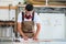 Carpenter or cabinet maker in his wood workshop