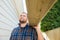 Carpenter Carrying Plank On Shoulder At