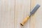 Carpenter chisel on wood background