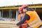 Carpenter and colleague load lumber