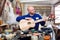 Carpenter creating guitar in workshop