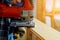 Carpenter cutting a wooden panel with the jigsaw, carpentry tools