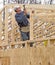 Carpenter framing gable end of house