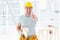Carpenter gesturing thumbs up at construction site