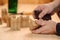 Carpenter hands polishing wood with sandpaper