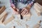 Carpenter hands taking measurement with a pencil of wooden plank. Concept of DIY woodwork and furniture making