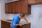 Carpenter installing c counter top in a kitchen