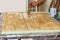 A carpenter makes a wooden background for subject shooting. Brow