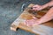 The Carpenter nailing wood board to make furniture