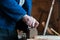 Carpenter planing a wood board