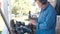 Carpenter polishes a wooden parts on a grinding machine.