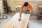 Carpenter polishing and varnishing a table