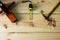 Carpenter`s for woodworking. Old Hammer and nail and wood plane and Measuring tape on texture wooden background