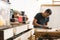 carpenter sanding a piece of wood. craft procedures with wood. Colombian man in his workshop