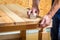 Carpenter sanding a table