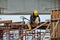 Carpenter sawing timber at the construction site