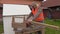 Carpenter sawing wooden plank