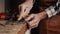 Carpenter sharpening a chisel. woodworking process with hand tools in a carpentry workshop. wood carving concept