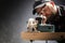 Carpenter slashes the board using an electric saw