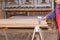 Carpenter smears the plywood with hand roller tool, spreader for evenly application of glue on the wooden surface