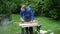 Carpenter smoothing renewing plank with grinder. Male using grinder machine
