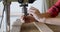 Carpenter tightening drill beat in vertical drill machine in workshop 4k