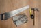 Carpenter tools: claw hamer, protective gloves, measure tape, an