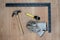 Carpenter tools: claw hamer, protective gloves, measuring tape,