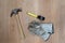 Carpenter tools: claw hamer, protective gloves, measuring tape