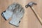 Carpenter tools: protective working gloves and a claw hamer