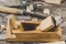 The carpenter tools on wooden bench, plane, chisel,mallet, tongs, pliers,nails