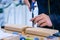 Carpenter using chisel to carve wood