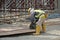 Carpenter using circular saw at the construction site