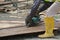 Carpenter using circular saw at the construction site