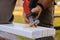 Carpenter using jigsaw for cutting wooden boards with power tools