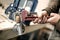 Carpenter using plier for his job in carpentry workshop