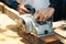 Carpenter using wood sander