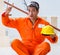 Carpenter wearing yellow hardhat in contractor workshop