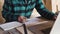 Carpenter work in his workshop with drawing equipment, paper, ruler, pencil and laptop