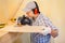 Carpenter at work using a circular saw