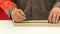 Carpenter working with tape measure,marking wooden desk