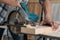 Carpenter working on wood craft at workshop