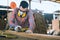 Carpenter is working in a woodworking office.caucasion white Carpenter using sandpaper to polish the wood and brush off the