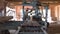 Carpenter working on workbench at sawmill, cutting lumber