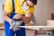 The carpenter working in the workshop