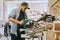 Carpenter works with wood in carpentry workshop. Man doing woodwork