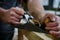 Carpenters experienced wood is using spokeshave to decorate the furniture. V2