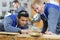 Carpenters measure wooden board in workshop