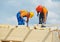 Carpenters at wooden roof work