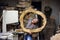 Carpenters workshop. Young woman excited with a wooden circle saw cut product